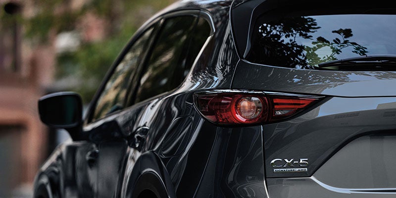 Grey 2020 Mazda cx-5 parked outside of a building near acadiana mazda of lafeyette