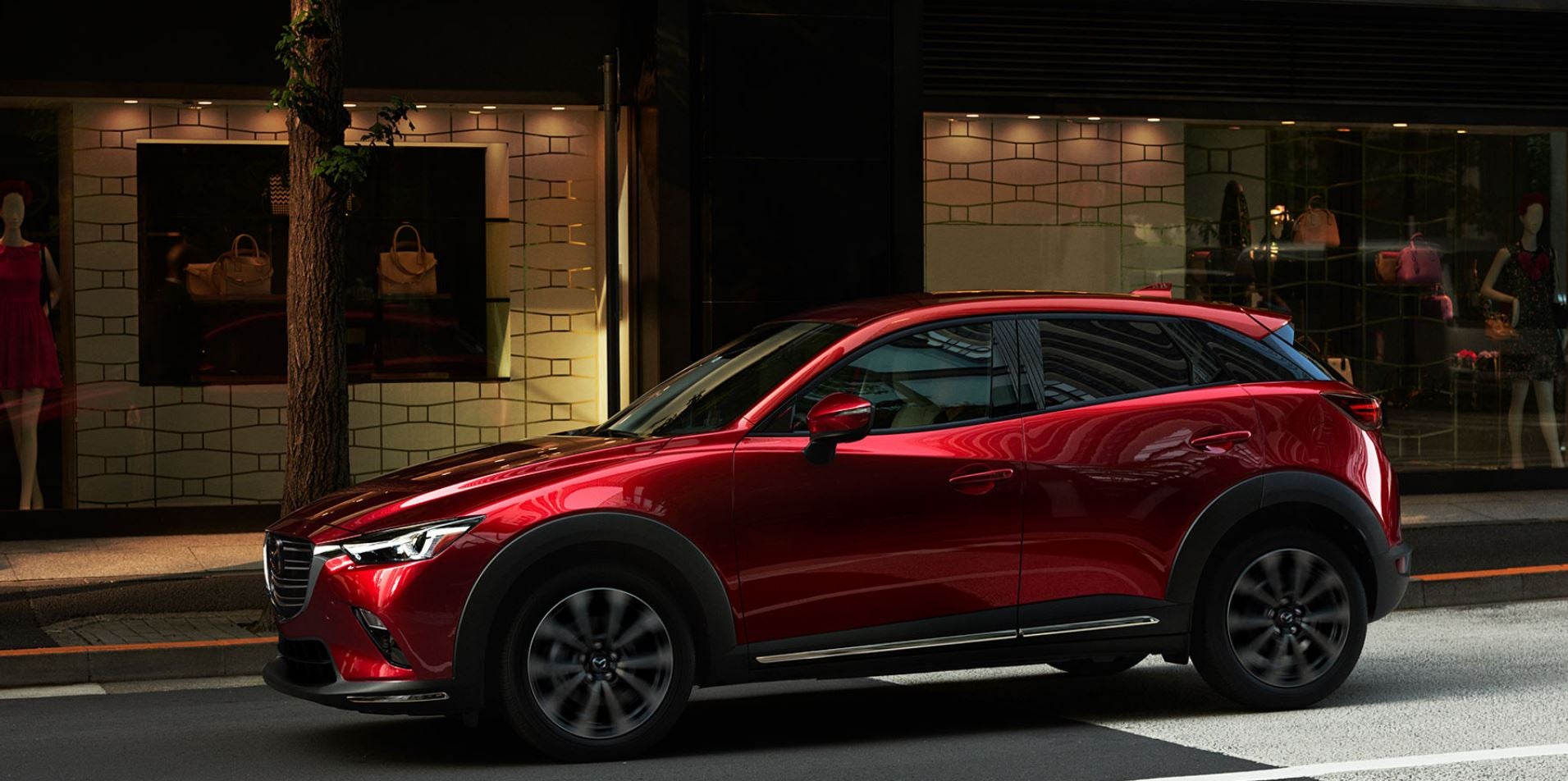 Red 2020 Mazda CX-30 parked outside of a building near Acadiana Mazda